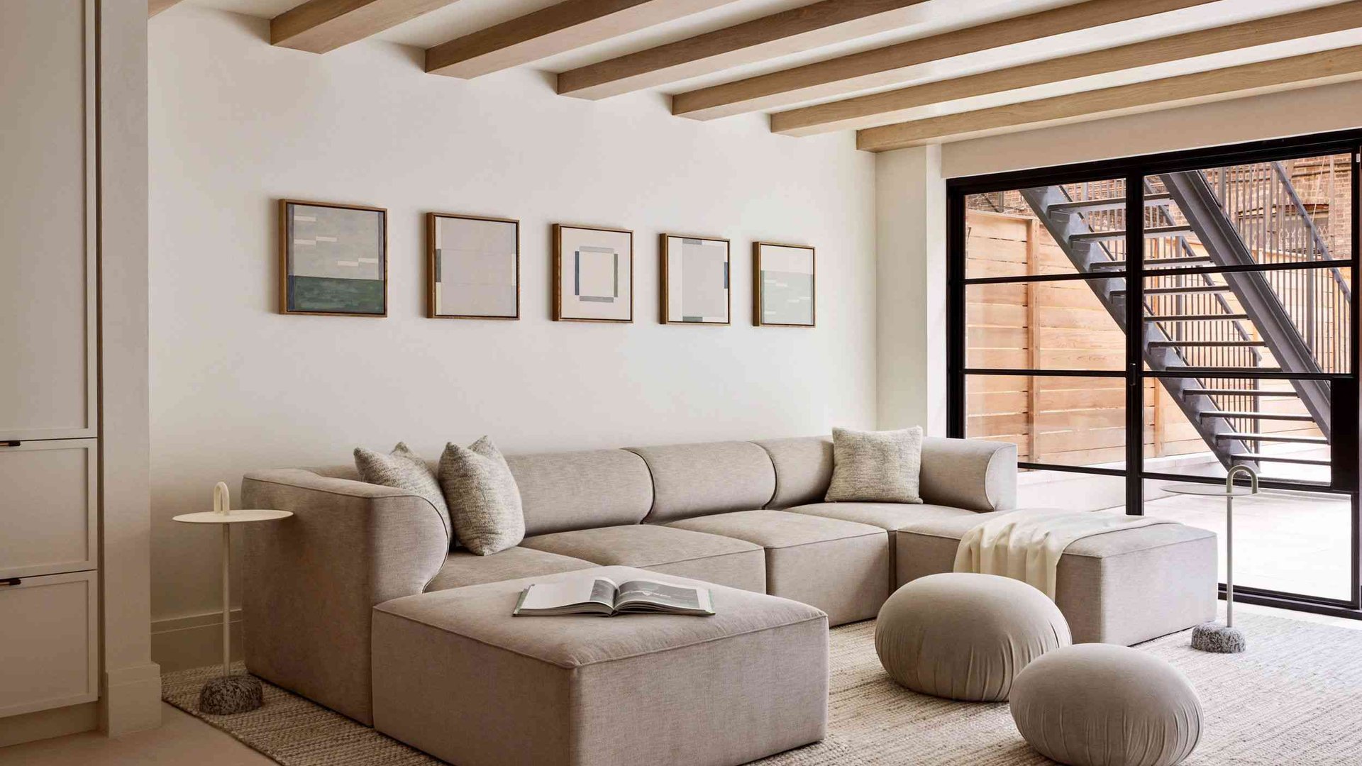 warm beige sofa soft taupe rug cool gray walls nat